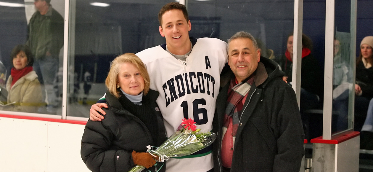 Gabe Carreiro '08 with his mother, Diane, and his father, Gil, on Senior Day in 2008.
