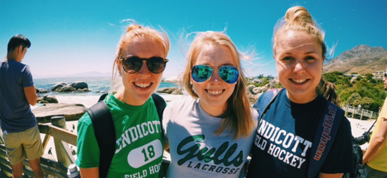 Field hockey players Ashleigh Allen, Brittany Bushey, and Erin McCarthy in South Africa.