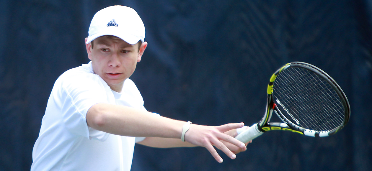 Christopher Kirkpatrick swings his racket at a tennis ball.