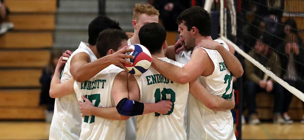 The Endicott men's volleyball team huddles up.