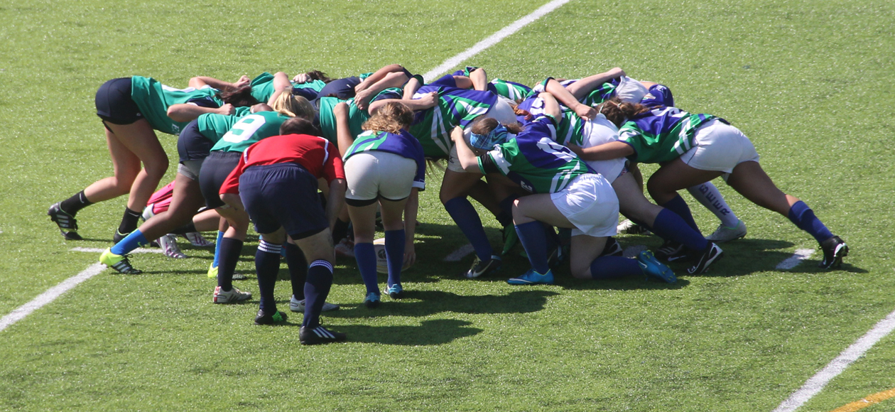 Women's rugby scrum.