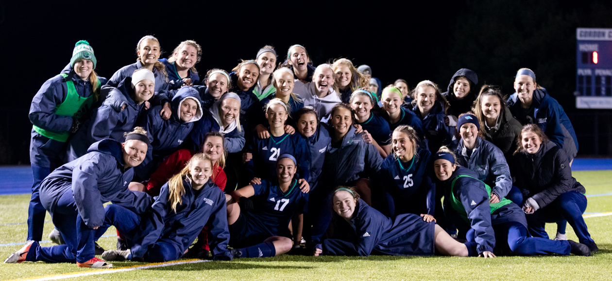 Image of the Endicott women's soccer team celebrating after defeating Gordon in the CCC Semifinals.