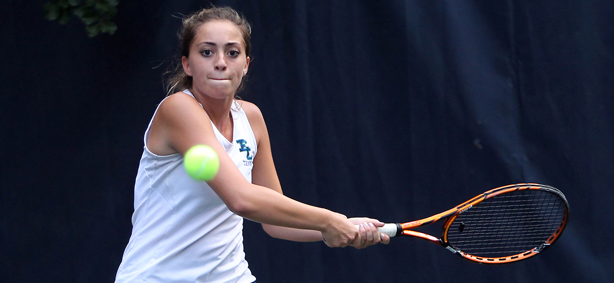 Lexi Losano swings at a tennis ball.