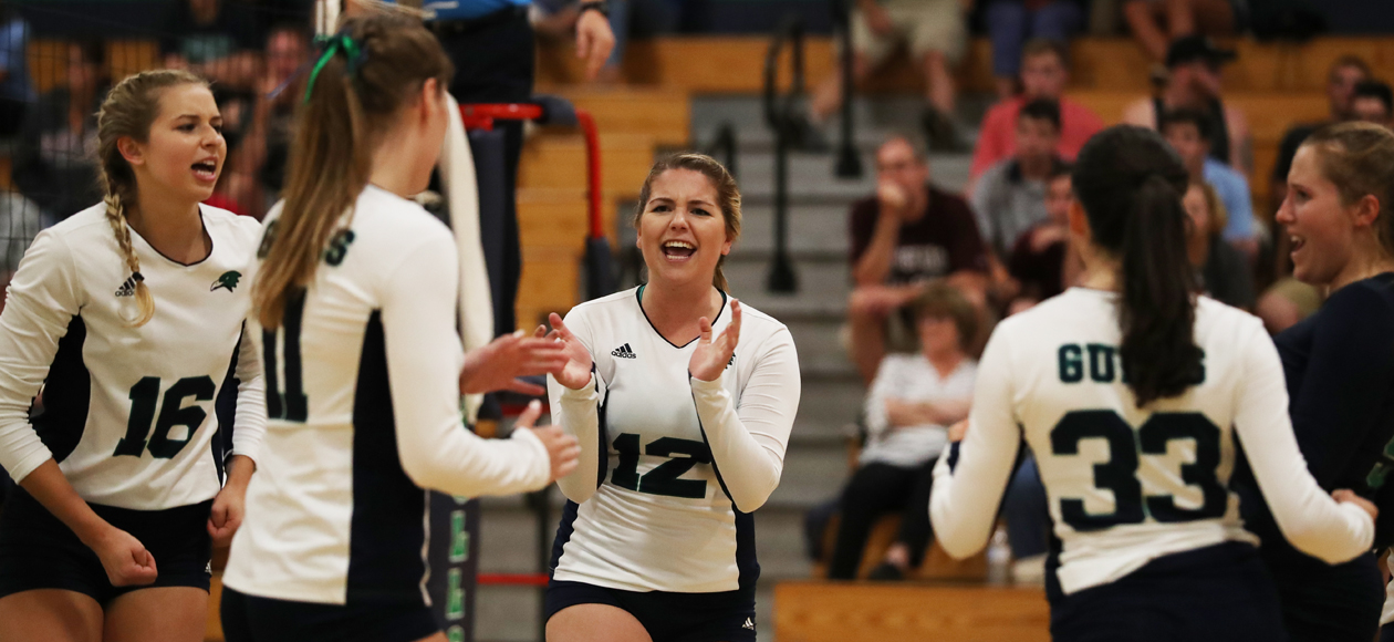 The women's volleyball team celebrates a point during their CCC Quarterfinal win over Gordon.