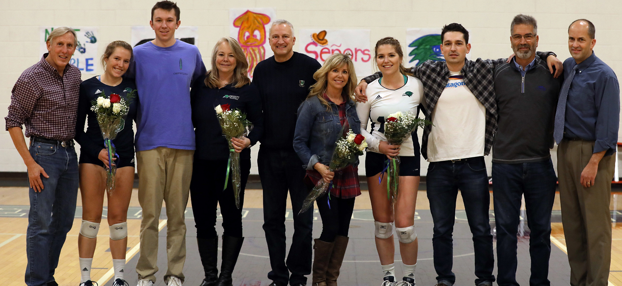 Women's volleyball seniors Cydney Pierce and Lauren Sheehan, with their families and head coach Tim Byram.