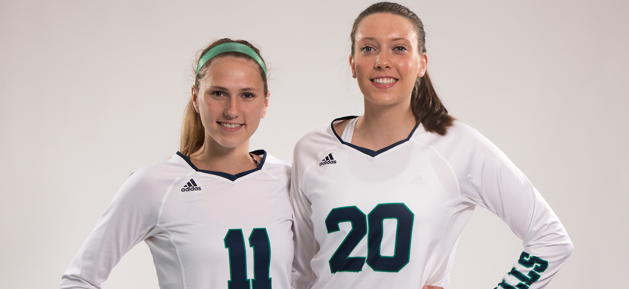 Staged photo of women's volleyball seniors Emma Mancini and Emily Diezemann.