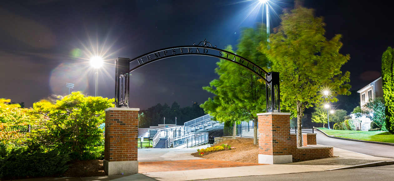 Image of the Hempstead Stadium entry way Arch at night.