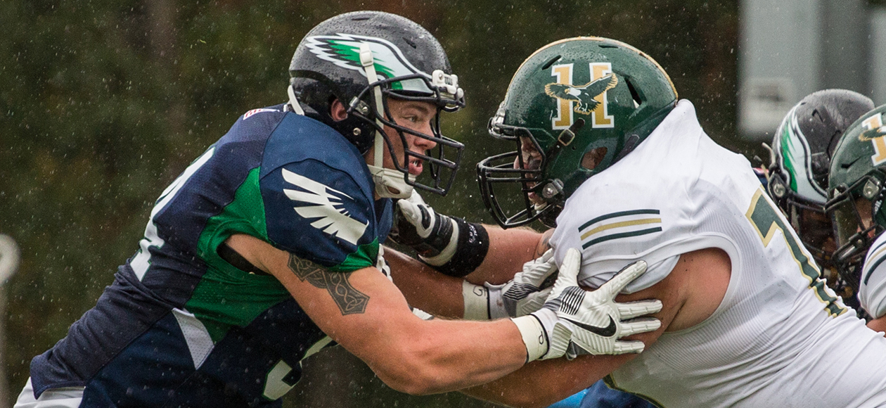 An Endicott defensive lineman gets blocked by a Husson offensive lineman.