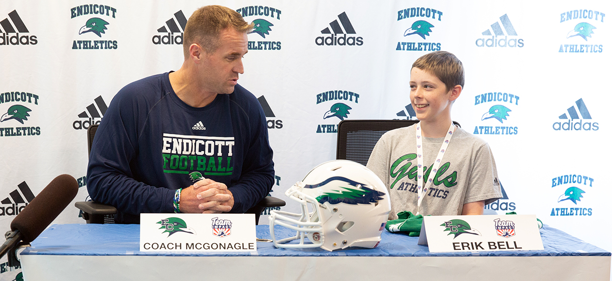 Paul McGonagle and Erik Bell at a Team IMPACT Press Conference.