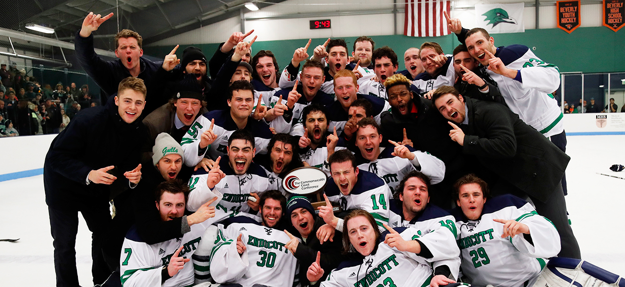 The Endicott men's ice hockey team poses with the CCC trophy after winning the conference championship.