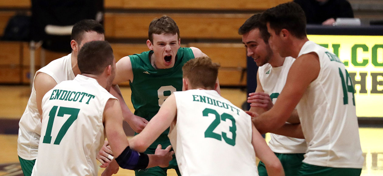 Men's volleyball student-athletes show emotion during a match.