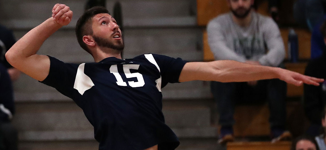Seth Braquet swings at a volleyball.