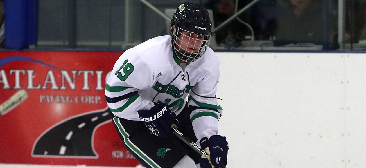 Jade Meier passes the puck to a teammate.