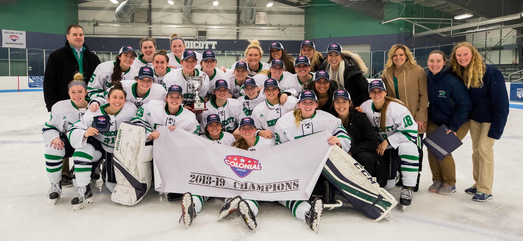 The Endicott women's ice hockey team with the CHC Championship banner. 