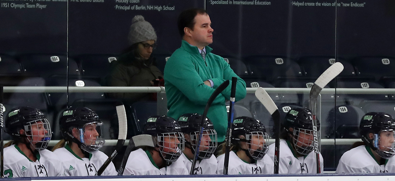 Head coach Andrew McPhee on the bench during a game. 