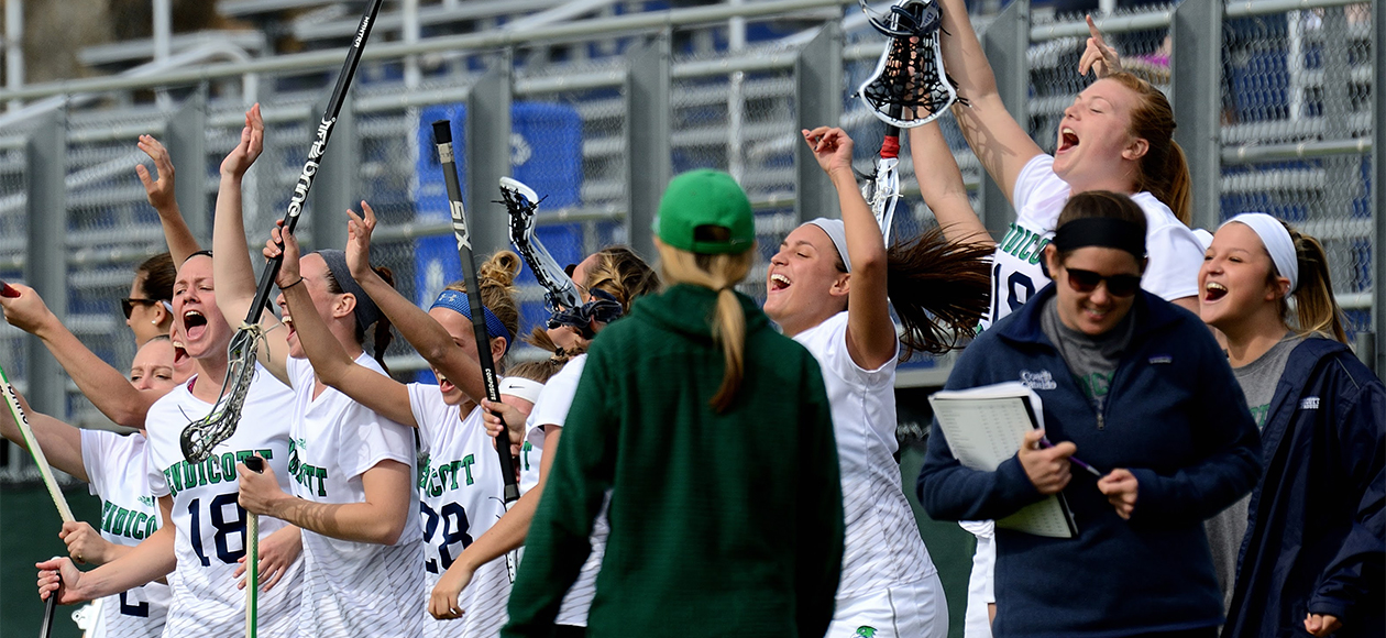 Endicott women's lacrosse celebrates its semifinal victory.