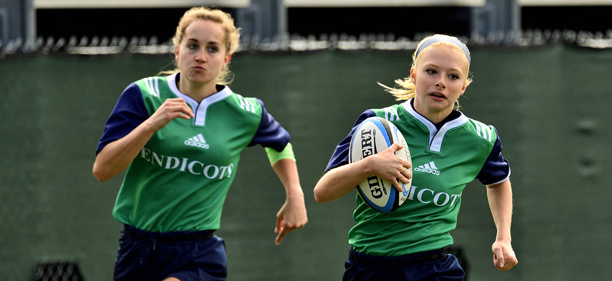Women's rugby game action.