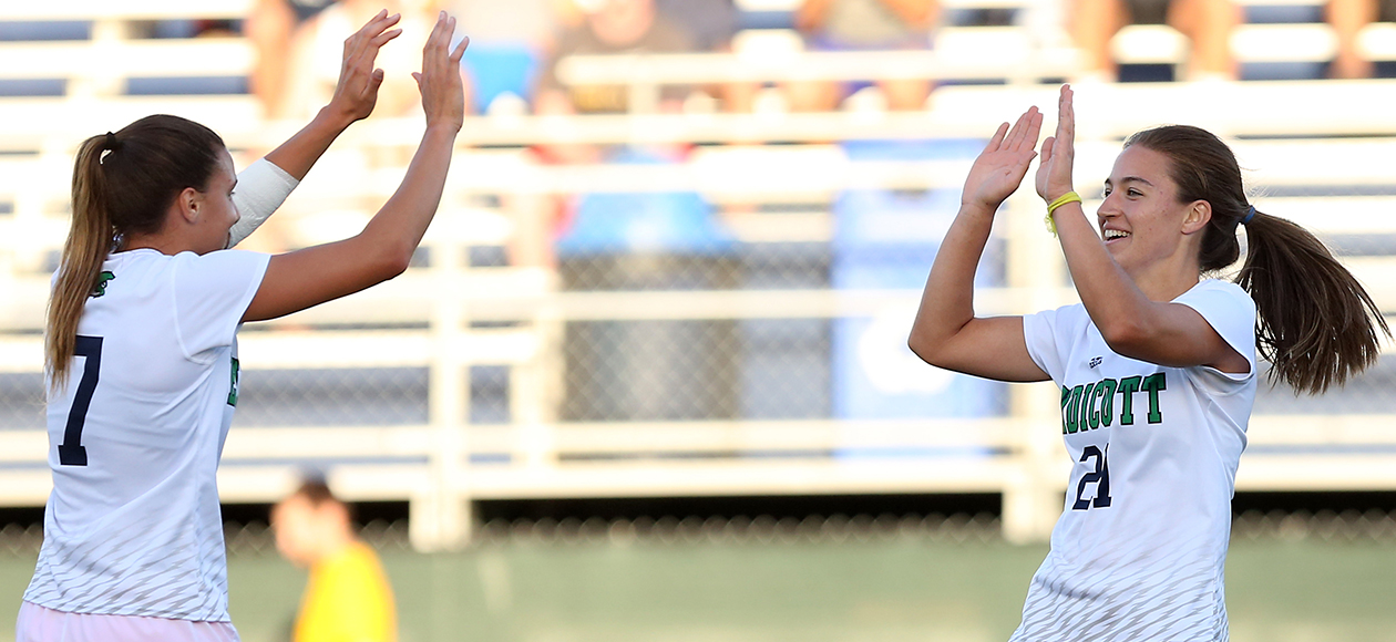 Sharlotte Pernice high-fives Rachel Hanna after a goal.