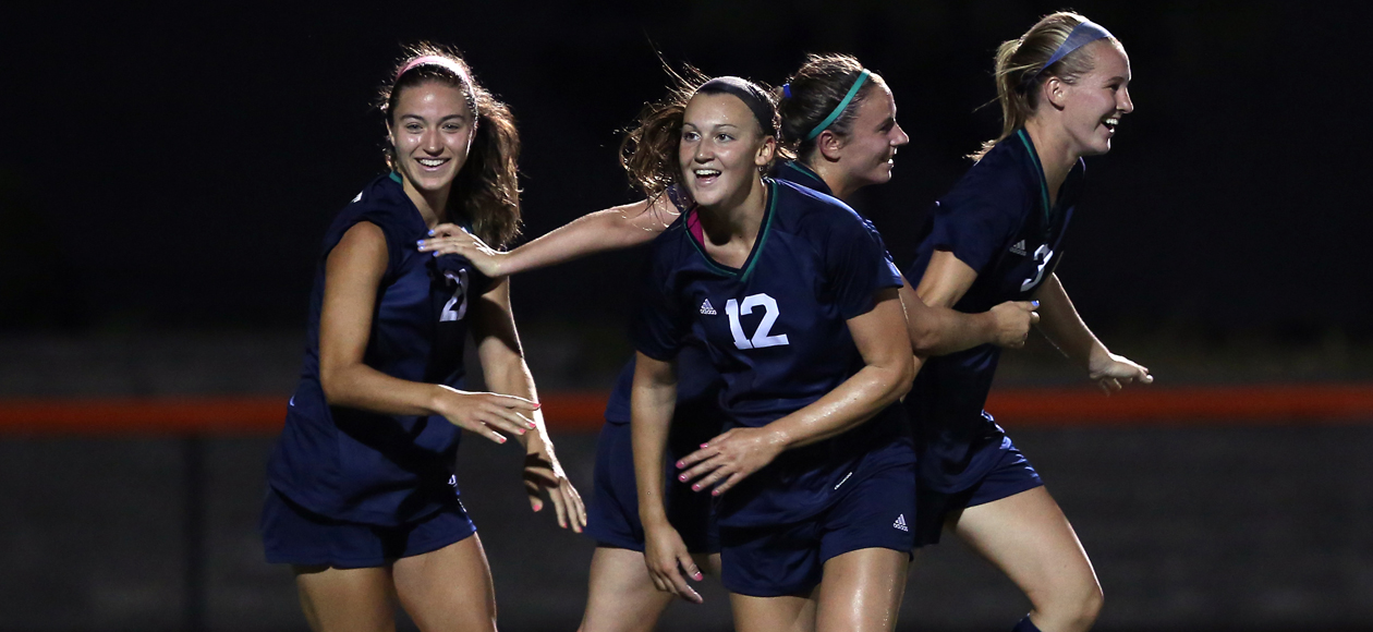 Mary Verneris (12) scored twice in the win against Salem State. Here, she celebrates with her teammates Rachel Hanna, Hannah Pesci and Larissa Cade.