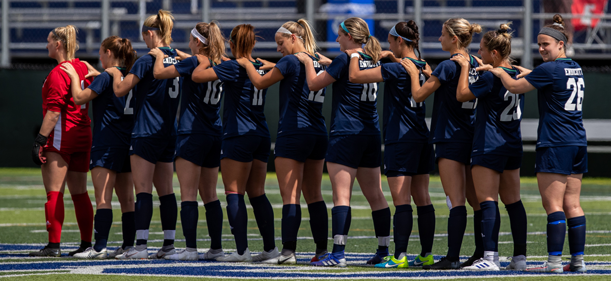 The Endicott women's soccer team's starting lineup during the National Anthem.