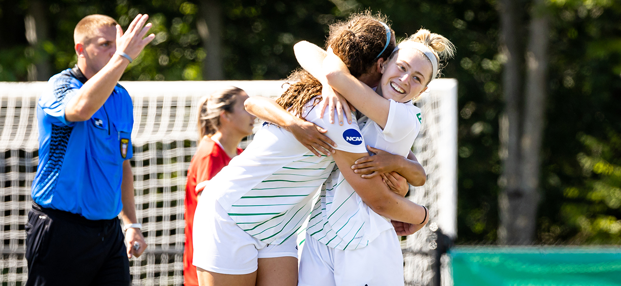 Endicott senior Julia Matus gets a hug from a teammate after scoring against Montclair St.