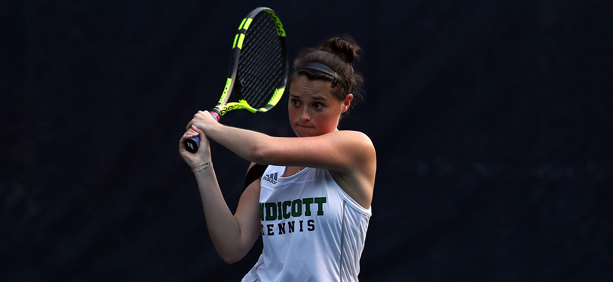 Lauren Rahr follows through on a forehand shot in tennis.