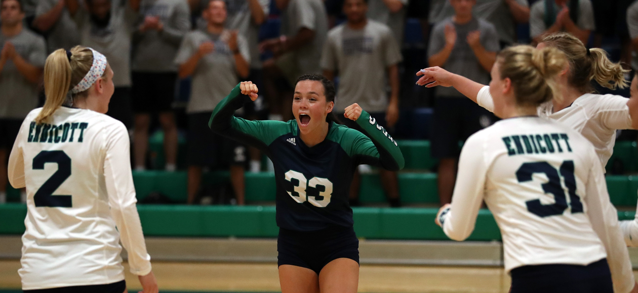 Image of Mackenzie Kennedy celebrating a point with her team.