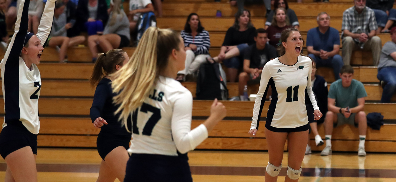 Remi Quesnelle, Nicole Winkler and Emma Mancini celebrate a point.