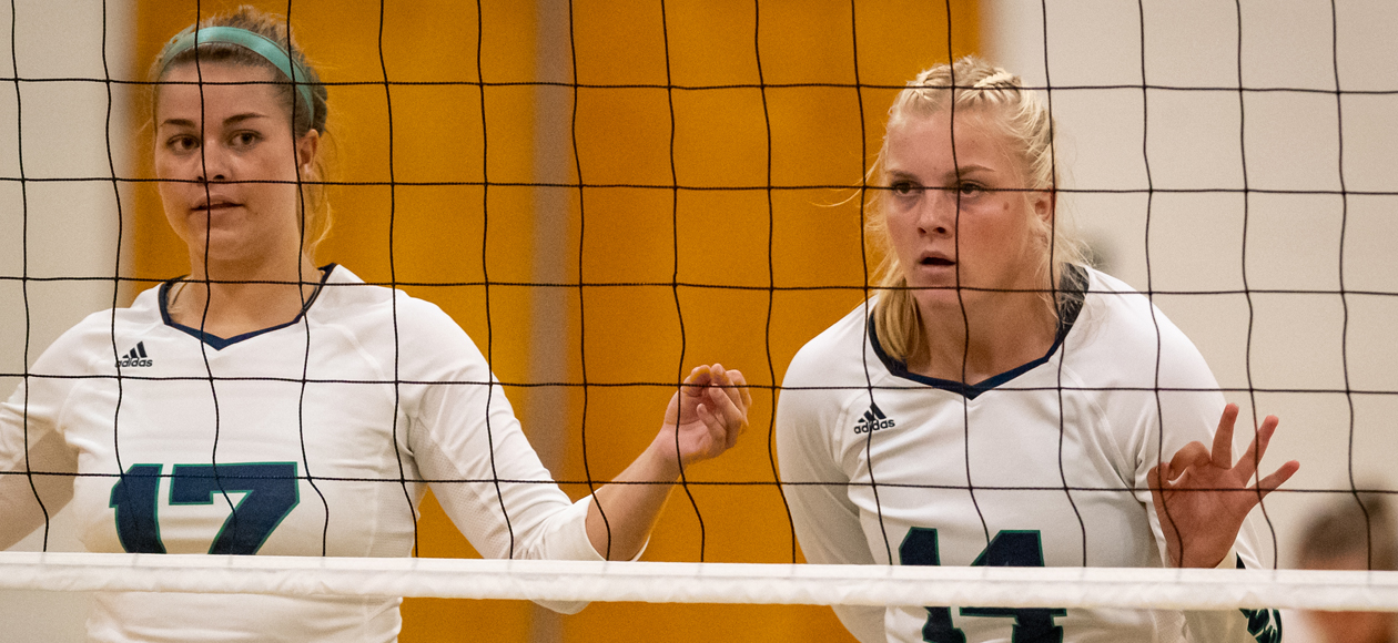 Image of Nicole Winkler and Meghan Frederick at the net.