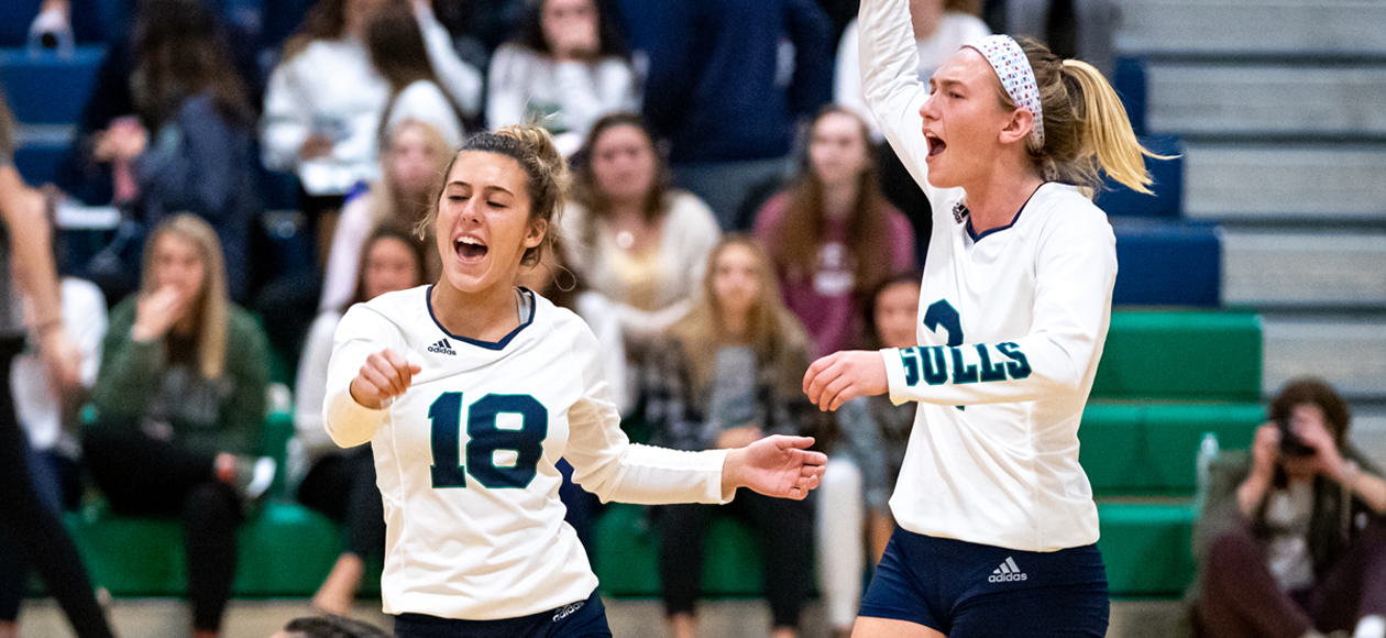 Image of Lauren McGrath and Remi Quesnelle celebrating a point against Roger Williams.